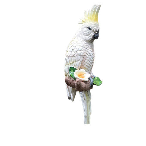 Une Statue D'un Jouet Oiseau Cacatoès Isolé Sur Blanc