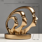 Statue visage abstraite dorée